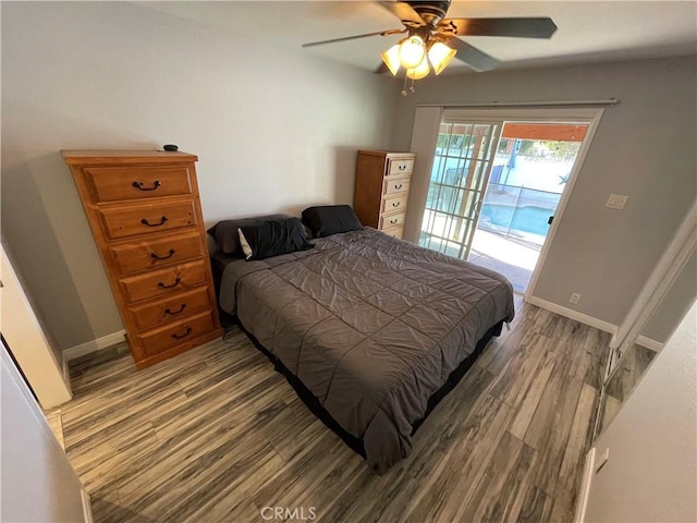 bedroom featuring hardwood / wood-style floors, access to exterior, and ceiling fan