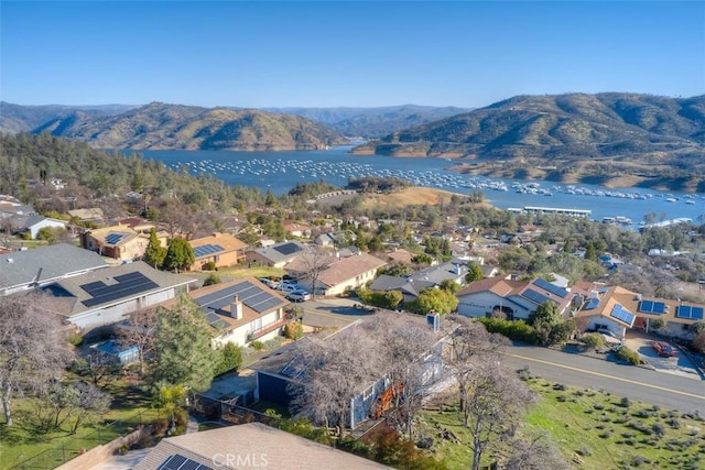 birds eye view of property featuring a residential view and a water and mountain view