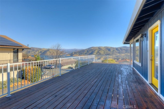 wooden deck with a mountain view