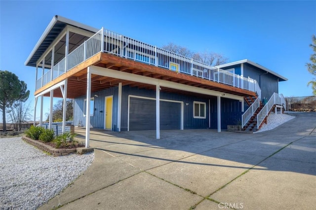 view of front of property with a deck and a garage