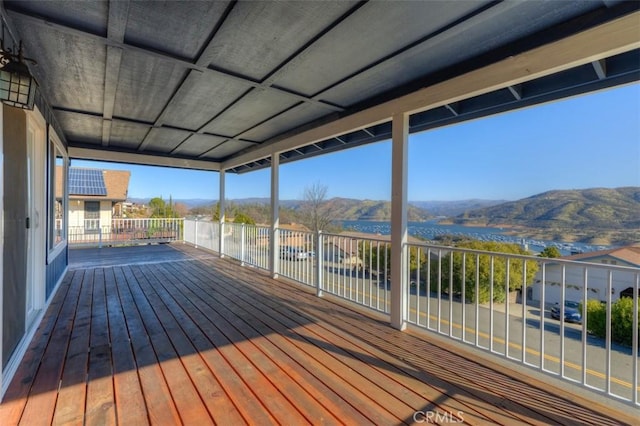 wooden deck with a mountain view