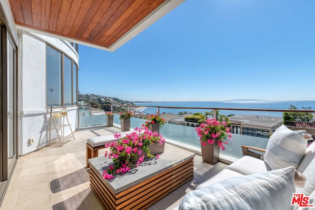 balcony featuring a water view