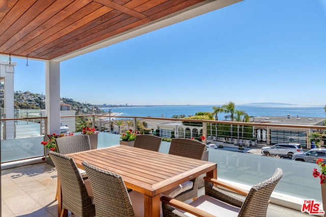 balcony featuring a water view