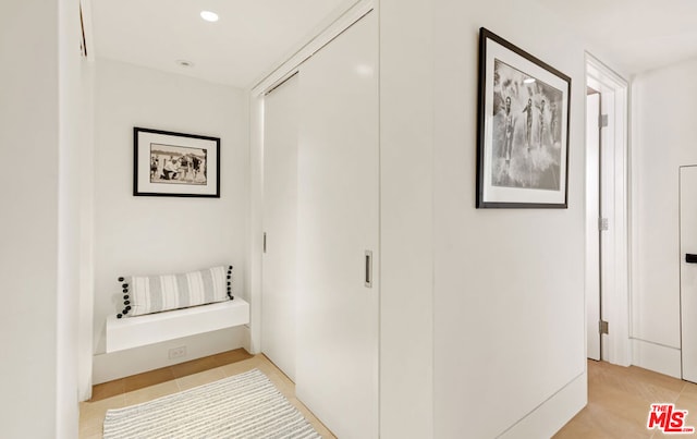 corridor with light tile patterned flooring