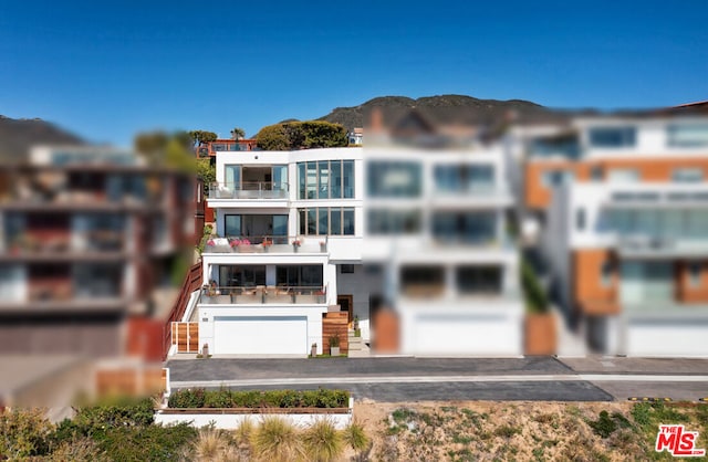 exterior space with a mountain view and a garage