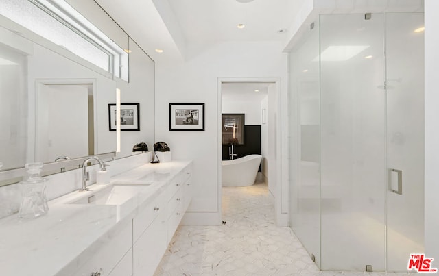 bathroom featuring independent shower and bath and vanity