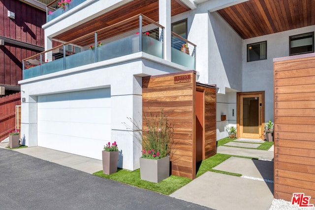 view of property exterior featuring a garage