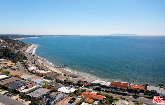 birds eye view of property featuring a water view and a view of the beach