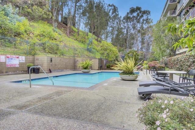 view of swimming pool featuring a patio