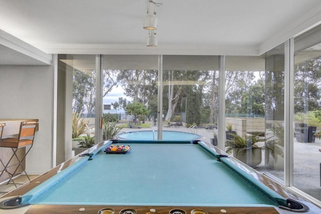 game room with floor to ceiling windows