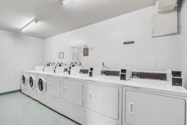 washroom featuring washing machine and clothes dryer