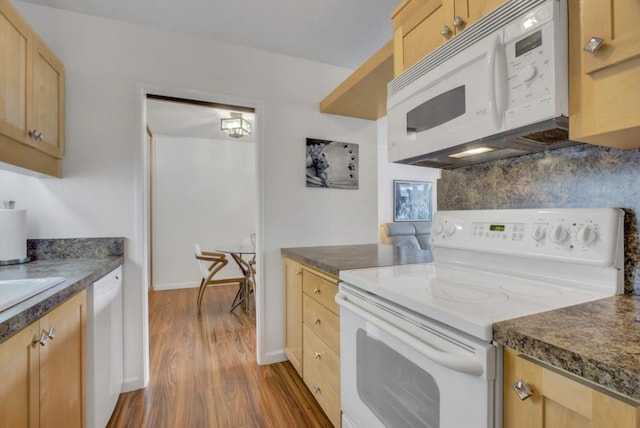 kitchen featuring white appliances, dark wood-type flooring, decorative backsplash, and light brown cabinets