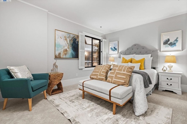 bedroom with crown molding and light colored carpet