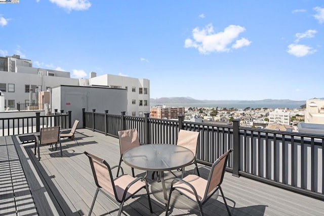 wooden deck with a mountain view