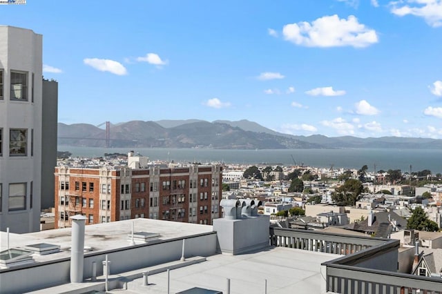 property's view of city featuring a water and mountain view