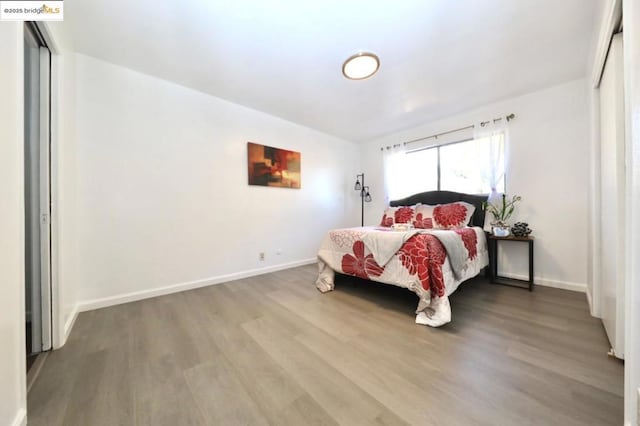 bedroom featuring hardwood / wood-style floors