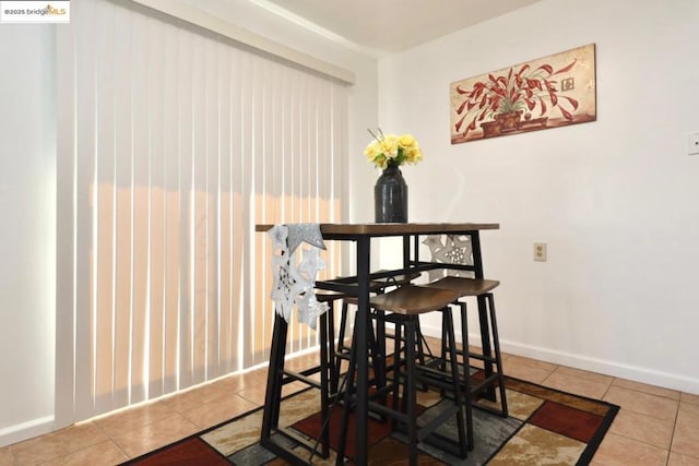 dining room featuring tile patterned flooring