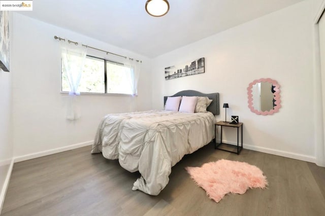 bedroom featuring dark hardwood / wood-style flooring