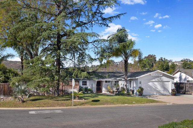 ranch-style house with a garage and a front lawn