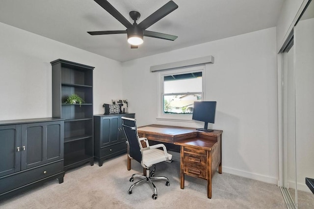 carpeted office with ceiling fan