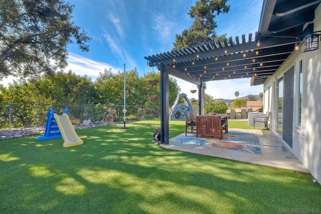 view of yard with a pergola and a patio