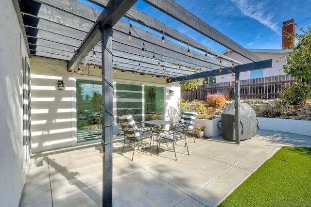 view of patio / terrace featuring area for grilling and a pergola