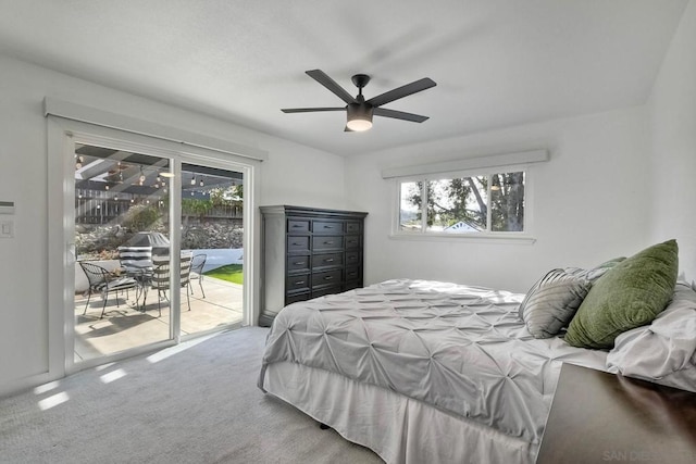 bedroom featuring multiple windows, carpet floors, ceiling fan, and access to outside