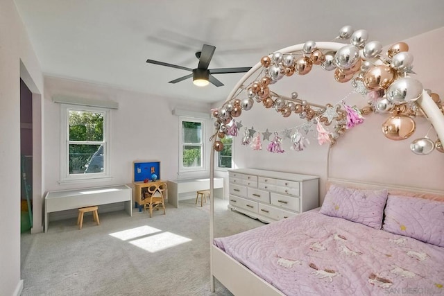 bedroom with light carpet and ceiling fan