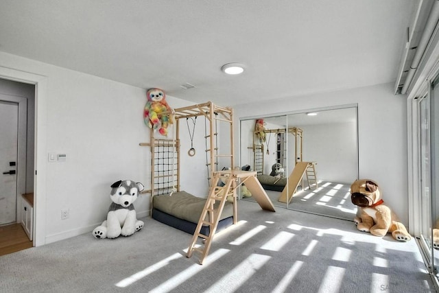 workout area featuring light colored carpet