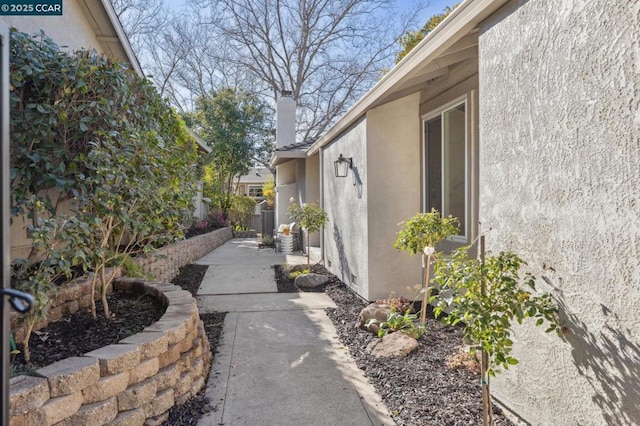 view of side of home with a patio area