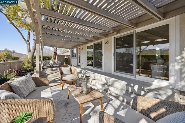 view of patio / terrace with an outdoor living space and a pergola