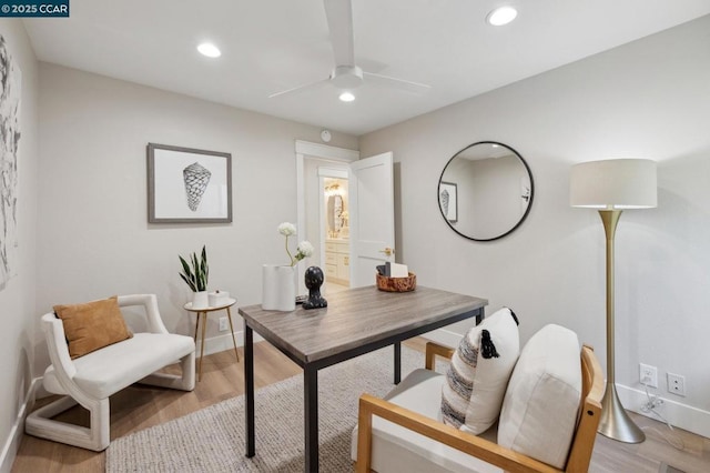 office area with ceiling fan and light hardwood / wood-style flooring