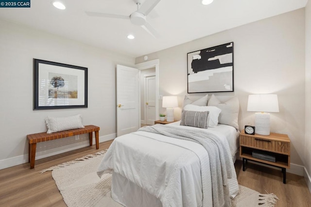 bedroom with hardwood / wood-style flooring and ceiling fan