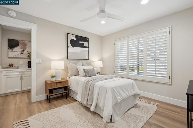 bedroom featuring ceiling fan and light wood-type flooring