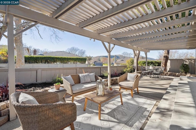 view of patio featuring outdoor lounge area and a pergola