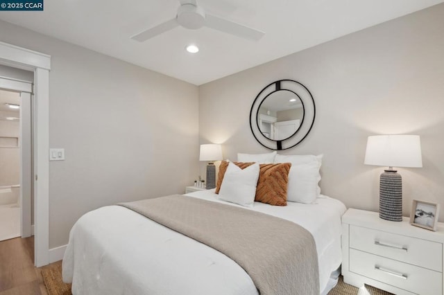 bedroom with ceiling fan and light wood-type flooring