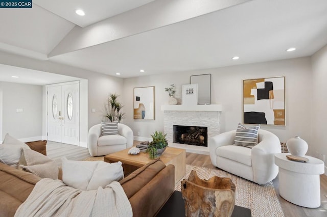 living room featuring hardwood / wood-style flooring and a fireplace