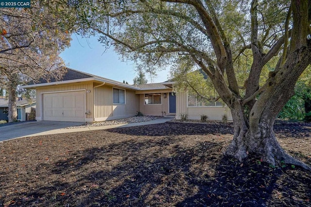 ranch-style home featuring a garage