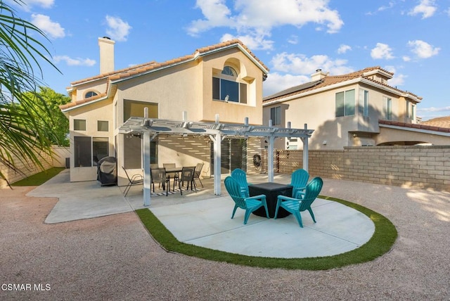 back of house featuring a patio area and a pergola