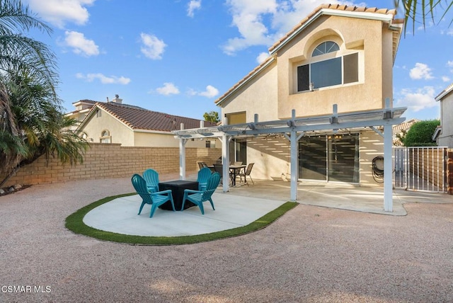 back of property with a patio and a pergola