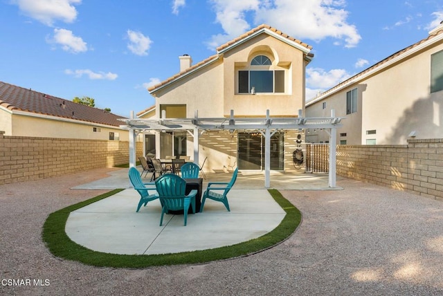 back of house with a patio and a pergola