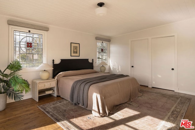 bedroom featuring dark hardwood / wood-style flooring