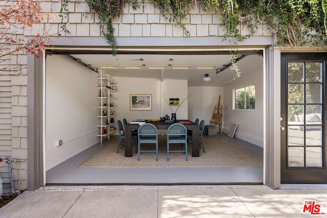 dining area featuring concrete flooring