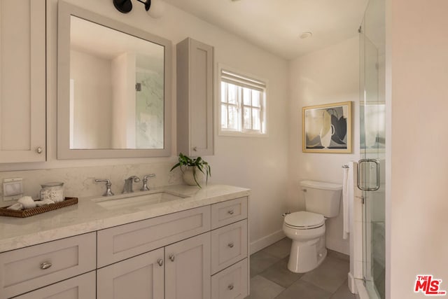 bathroom featuring a shower with door, toilet, tile patterned floors, and vanity