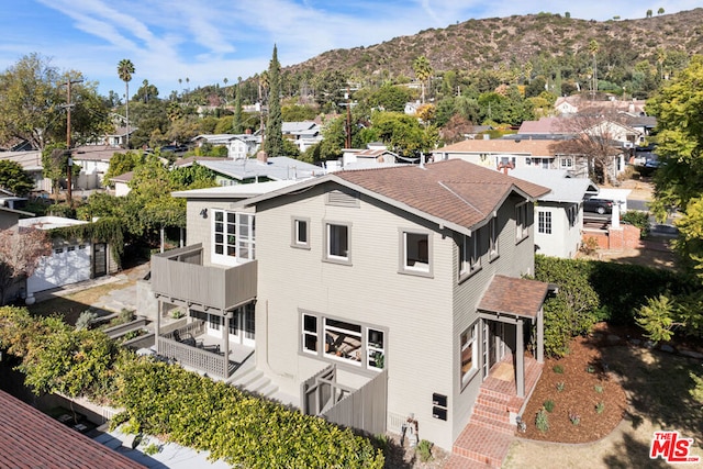 birds eye view of property with a mountain view