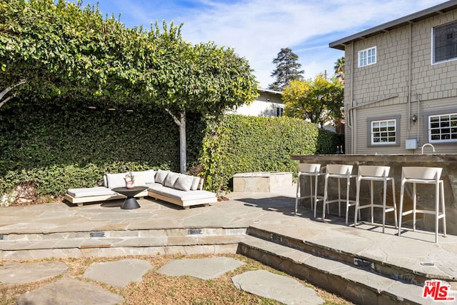 view of patio featuring an outdoor bar and outdoor lounge area