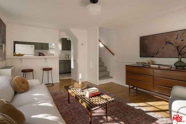 living room with dark hardwood / wood-style flooring