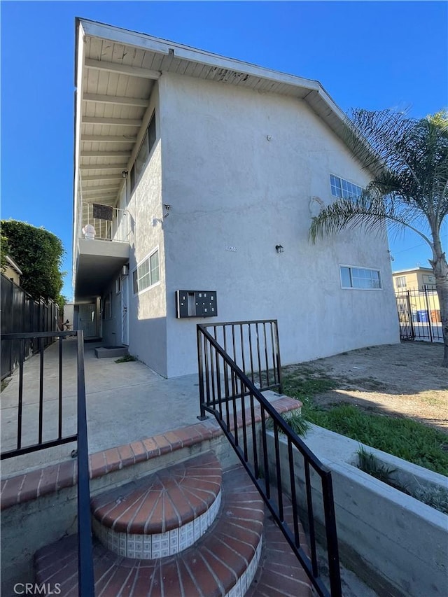 view of side of property featuring a balcony