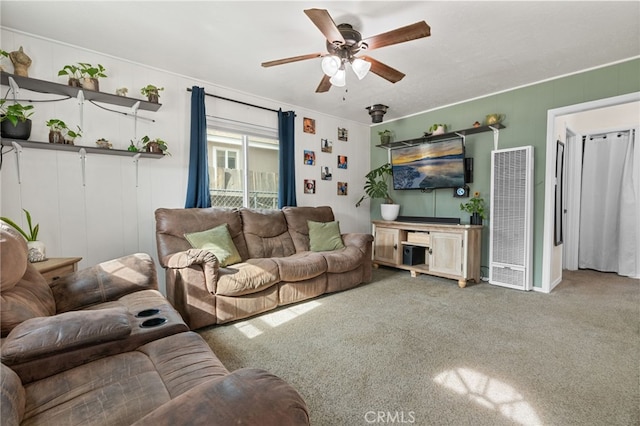 carpeted living room featuring ceiling fan