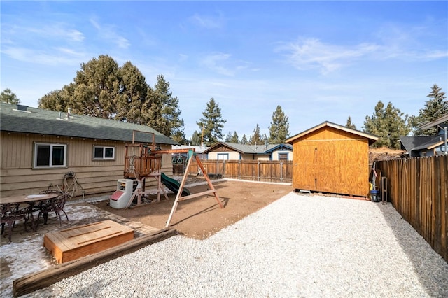 view of yard featuring a playground and a patio